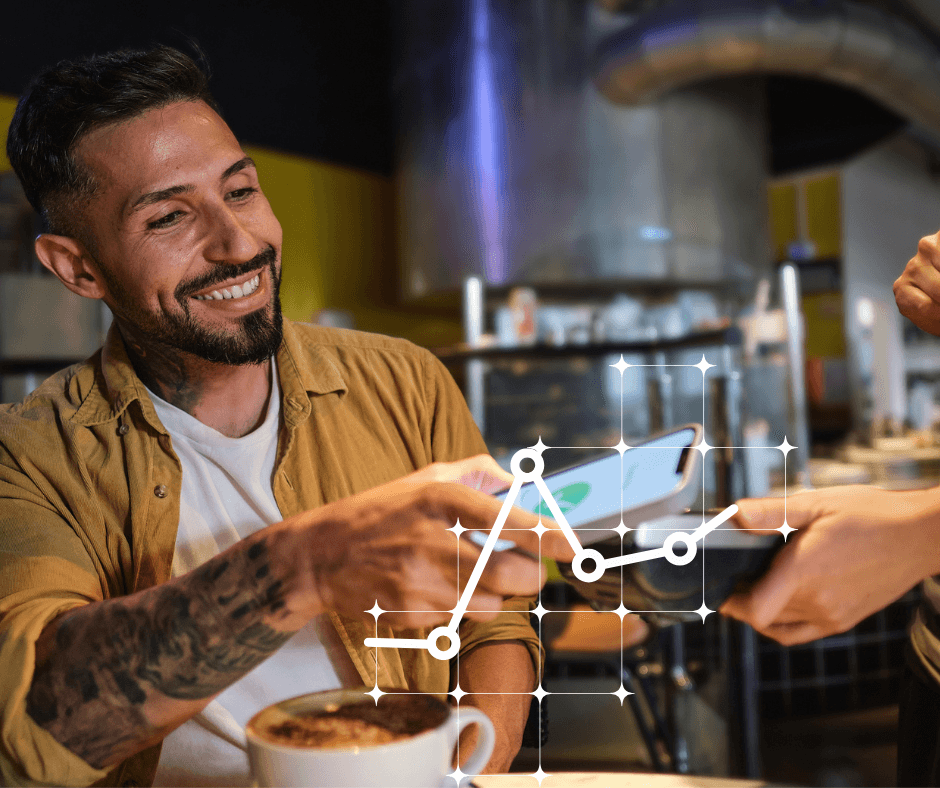 A man taps his phone to pay for something, generating smart data